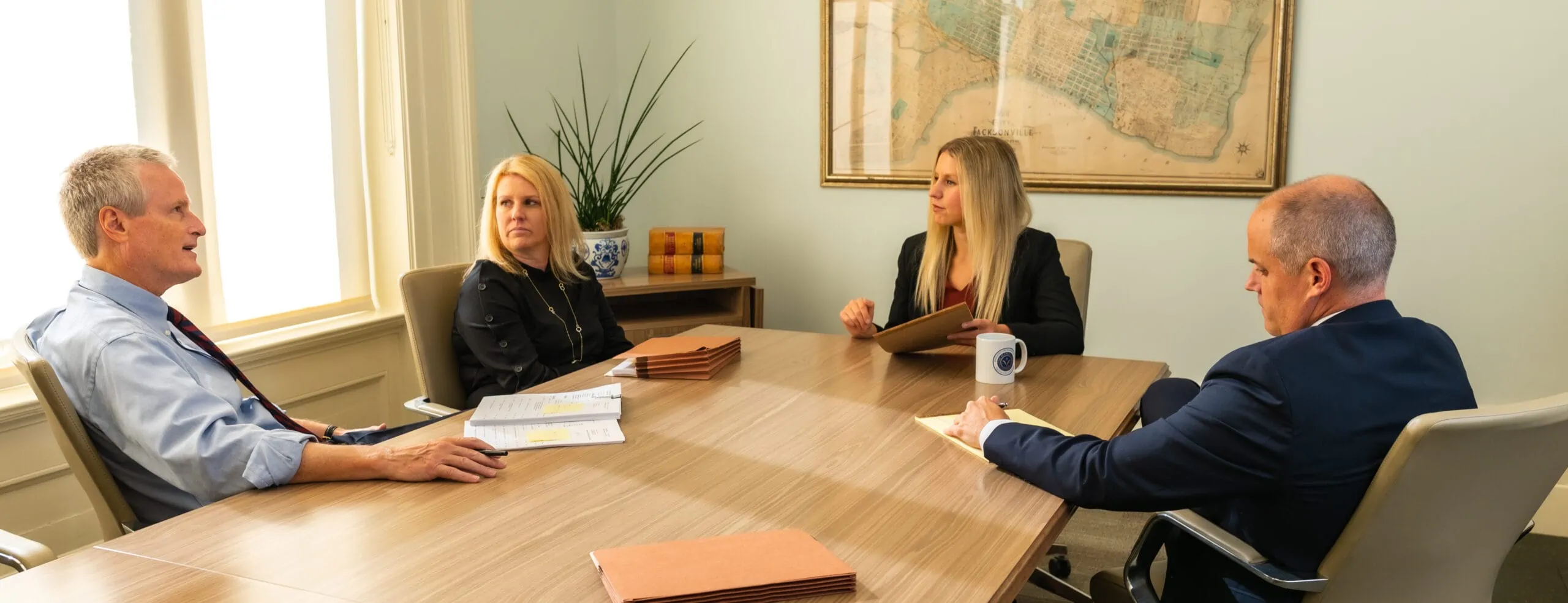 Group of attorneys sitting around a table