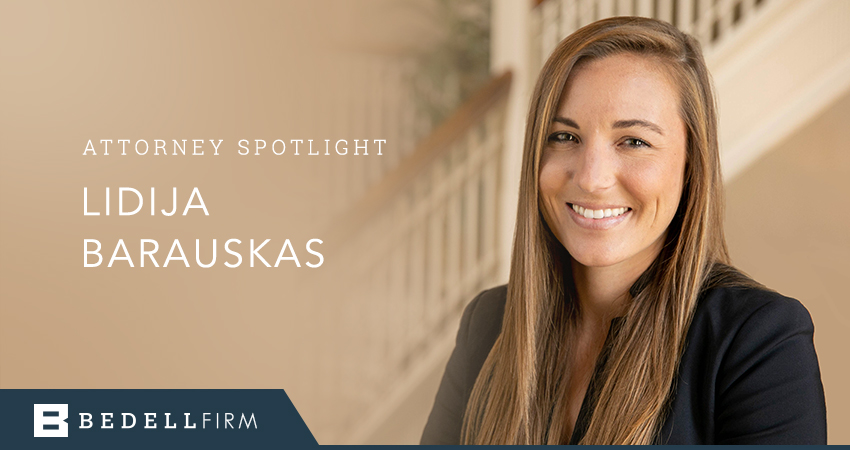 Lidija Barauskas smiles. Text to her left reads "Attorney spotlight Lidija Barauskas"