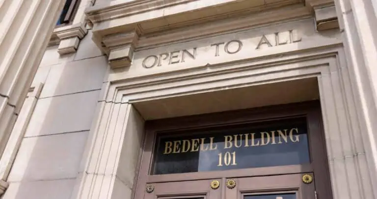 Bedell Firm building with 'Open to All' sign