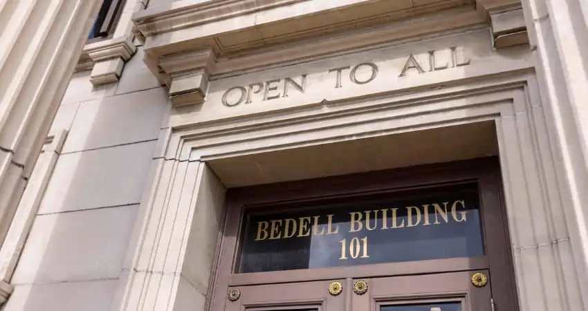 Bedell Firm building with 'Open to All' sign