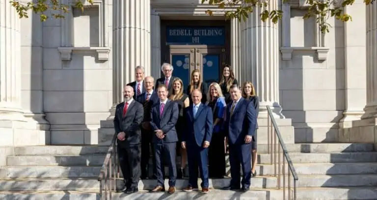 Bedell Firm attorneys outside of the Bedell Firm building