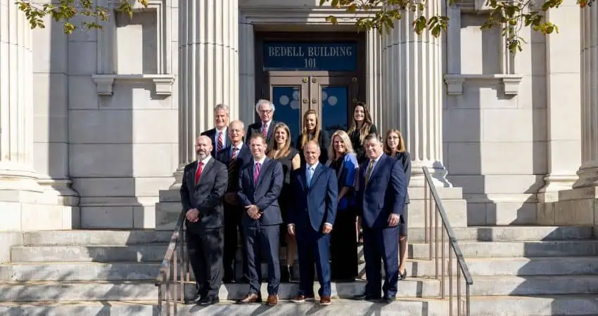 Bedell Firm attorneys outside of the Bedell Firm building