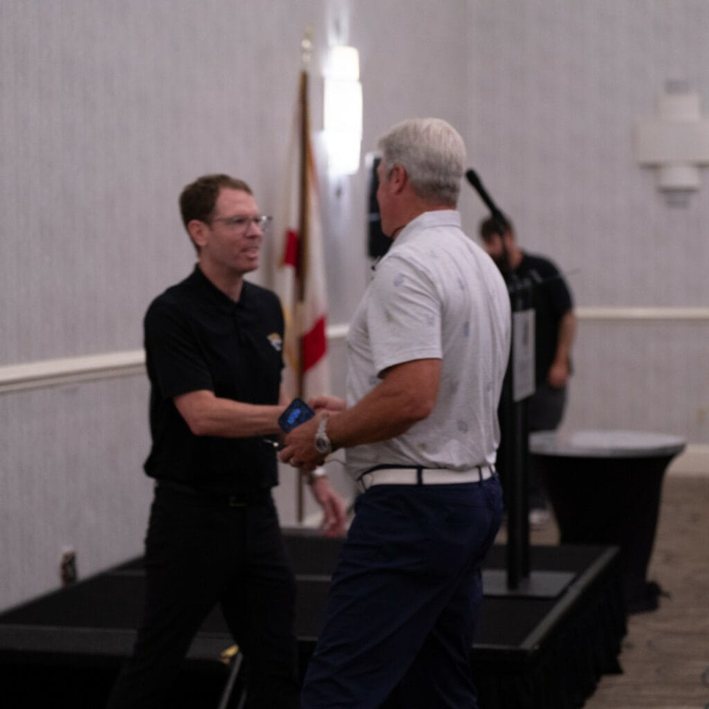 Brian shaking Doug Pederson's hand