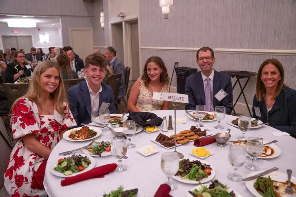 Brian Coughlin sitting at a table with his family.